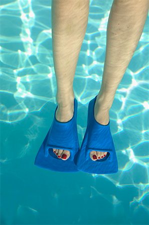 paint toe nails - Overhead view of feet in swim fins. Stock Photo - Premium Royalty-Free, Code: 673-02138224