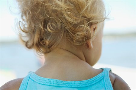 Rear view of a blonde baby girl's curls. Stock Photo - Premium Royalty-Free, Code: 673-02138321