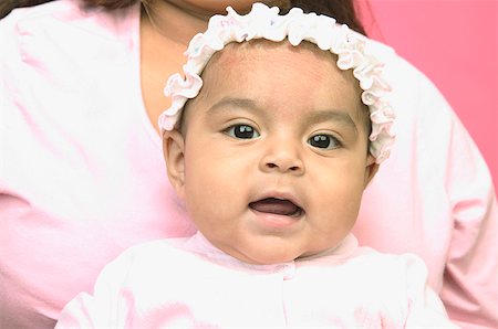 A baby girl with her mother. Stock Photo - Premium Royalty-Free, Code: 673-02138346