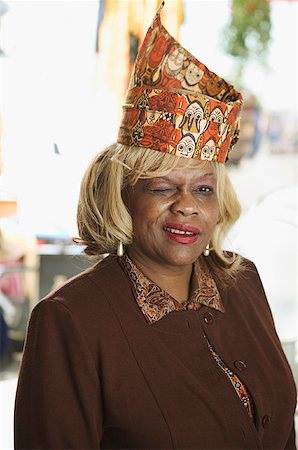 A senior woman with blonde hair and a fancy hat. Stock Photo - Premium Royalty-Free, Code: 673-02138505