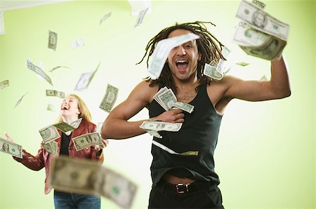dollars money happy smiling people not illustration - Man and woman catching falling money. Stock Photo - Premium Royalty-Free, Code: 673-02138637