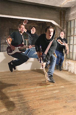 rocking out - Four men in a band rock out Stock Photo - Premium Royalty-Free, Code: 673-02138691