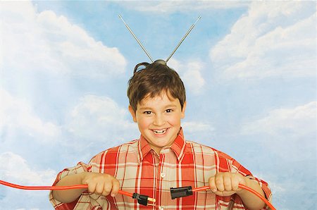 A young boy with antennae on his head Stock Photo - Premium Royalty-Free, Code: 673-02138718