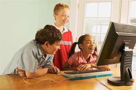 simsearch:673-02138722,k - Three children using a home computer Stock Photo - Premium Royalty-Free, Code: 673-02138727