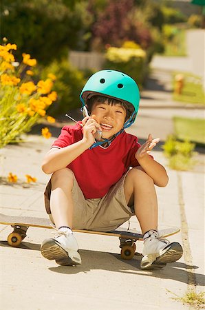 simsearch:673-02139120,k - A young skateboarder talking on his mobile phone Stock Photo - Premium Royalty-Free, Code: 673-02138745