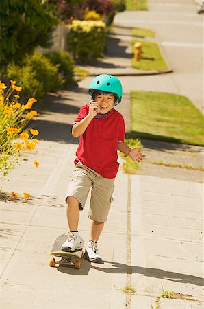 simsearch:673-02138722,k - A young skateboarder talking on his mobile phone Stock Photo - Premium Royalty-Free, Code: 673-02138746