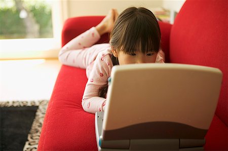 simsearch:673-02138722,k - Young girl working on a laptop Stock Photo - Premium Royalty-Free, Code: 673-02138743