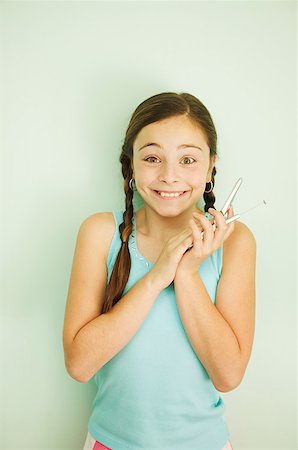 simsearch:673-02138722,k - Young girl with a mobile phone Stock Photo - Premium Royalty-Free, Code: 673-02138750