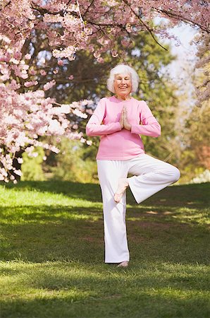 Older woman in a yoga position Stock Photo - Premium Royalty-Free, Code: 673-02138832