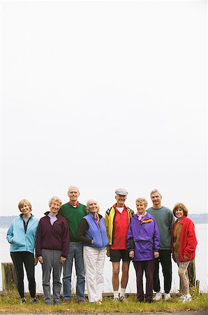 Eight middle-aged men and women in a row Stock Photo - Premium Royalty-Free, Code: 673-02138904