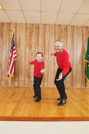 Young boy and man dancing on stage Stock Photo - Premium Royalty-Free, Code: 673-02138964