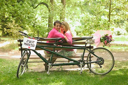 Newlyweds relax after a bicycle ride Stock Photo - Premium Royalty-Free, Code: 673-02138995