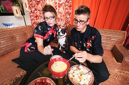 funny animal red - Couple at home having fondue Stock Photo - Premium Royalty-Free, Code: 673-02139024