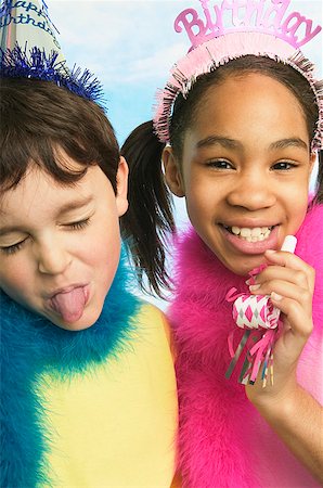 Boy and girl in party hats Stock Photo - Premium Royalty-Free, Code: 673-02139057