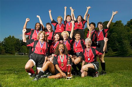 posing with trophy - Female soccer team celebrating Stock Photo - Premium Royalty-Free, Code: 673-02139175