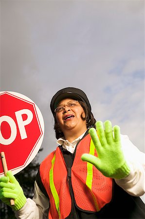 A female crossing guard at work Stock Photo - Premium Royalty-Free, Code: 673-02139188