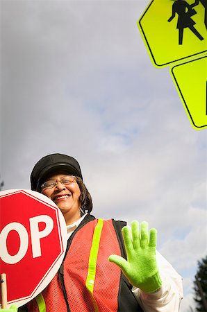 A female crossing guard at work Stock Photo - Premium Royalty-Free, Code: 673-02139189