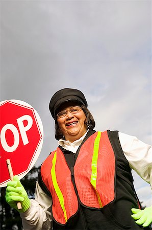 sorveglianza - A female crossing guard Fotografie stock - Premium Royalty-Free, Codice: 673-02139180