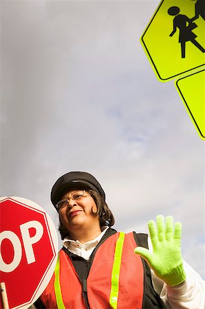 A female crossing guard at work Foto de stock - Sin royalties Premium, Código: 673-02139190