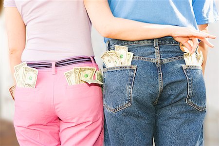 pick pocket - Woman taking money from man's pocket Stock Photo - Premium Royalty-Free, Code: 673-02139328