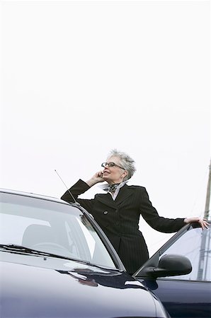 simsearch:673-02138722,k - Woman next to car using mobile phone Stock Photo - Premium Royalty-Free, Code: 673-02139387
