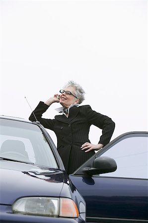 simsearch:673-02138722,k - Woman next to car using mobile phone Stock Photo - Premium Royalty-Free, Code: 673-02139389