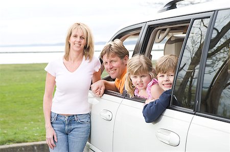 fuoristrada - Happy family together in minivan Fotografie stock - Premium Royalty-Free, Codice: 673-02139401