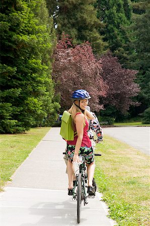 riding a tandem bike - Couple riding tandem bicycle Stock Photo - Premium Royalty-Free, Code: 673-02139416