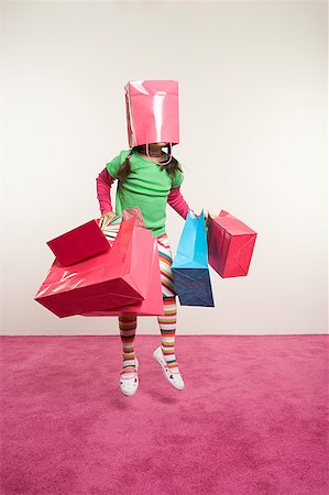 enigma - Jumping girl with shopping bags Stock Photo - Premium Royalty-Free, Code: 673-02139438