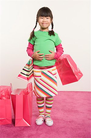 Girl holding shopping bags Stock Photo - Premium Royalty-Free, Code: 673-02139465