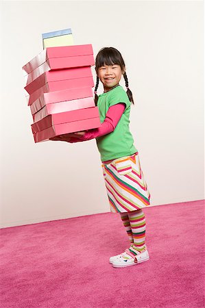 Girl holding many boxes Stock Photo - Premium Royalty-Free, Code: 673-02139469