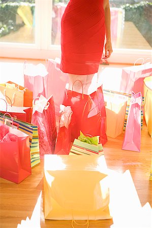 Woman surrounded by shopping bags Stock Photo - Premium Royalty-Free, Code: 673-02139476