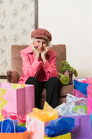 Happy woman surrounded by shopping bags Stock Photo - Premium Royalty-Free, Code: 673-02139495