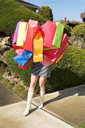 enigma - Woman carrying many shopping bags Stock Photo - Premium Royalty-Free, Code: 673-02139490