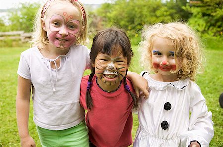 face paint kid - Girls wearing face paint Stock Photo - Premium Royalty-Free, Code: 673-02139504