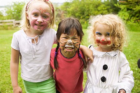 Girls wearing face paint Stock Photo - Premium Royalty-Free, Code: 673-02139504