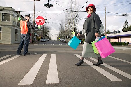 pedestrian (female) - Woman with shopping bags crossing street Stock Photo - Premium Royalty-Free, Code: 673-02139501