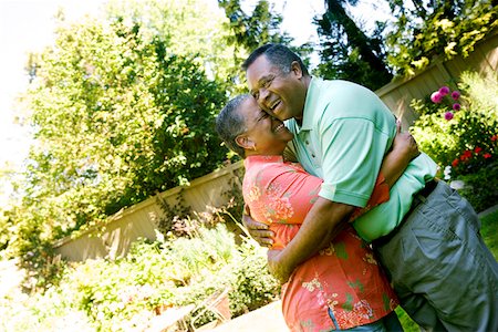 senior couple candid outdoors - Couple hugging outdoors Stock Photo - Premium Royalty-Free, Code: 673-02139580