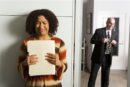 sad office man - Geeky man pursuing female co- worker Stock Photo - Premium Royalty-Free, Code: 673-02139640
