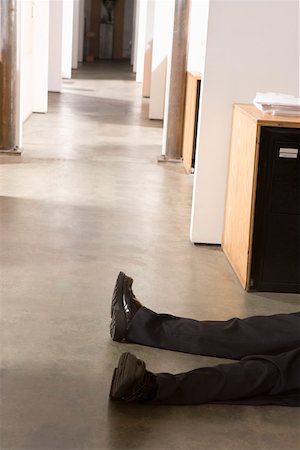 fainting - Prone body of a male office worker Stock Photo - Premium Royalty-Free, Code: 673-02139660