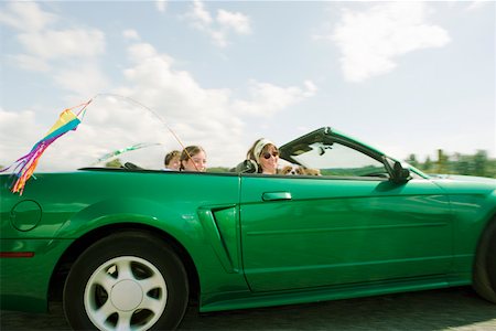 family portrait daughter dog - Family riding in convertible car Stock Photo - Premium Royalty-Free, Code: 673-02139756