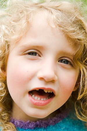 Young girl with a missing tooth Stock Photo - Premium Royalty-Free, Code: 673-02139816