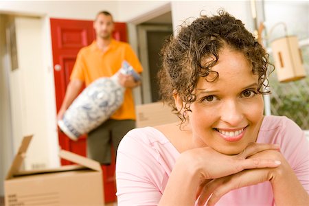 simsearch:673-02140216,k - Smiling woman with moving boxes Stock Photo - Premium Royalty-Free, Code: 673-02139887