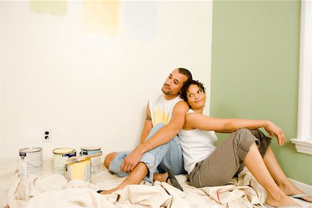 Tired couple with painting supplies Stock Photo - Premium Royalty-Free, Code: 673-02139882