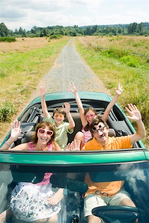 Enthusiastic silly family in convertible Stock Photo - Premium Royalty-Free, Code: 673-02139979