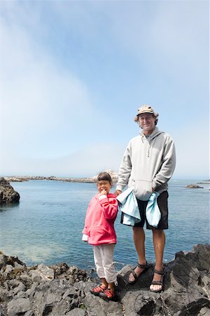 shy child adults - Father and daughter enjoying seaside stroll Stock Photo - Premium Royalty-Free, Code: 673-02139990