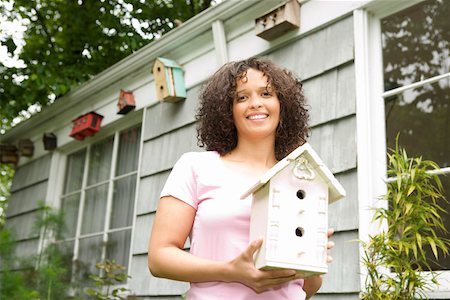 simsearch:673-02140216,k - Woman outside holding birdhouse Stock Photo - Premium Royalty-Free, Code: 673-02140236