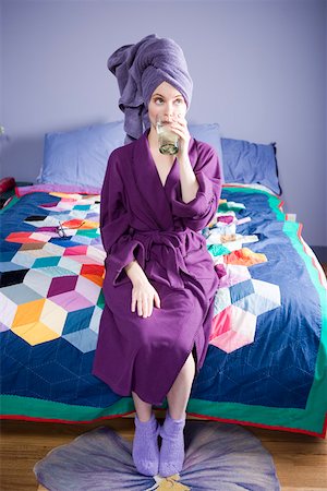 Woman in bathrobe drinking water Stock Photo - Premium Royalty-Free, Code: 673-02140292