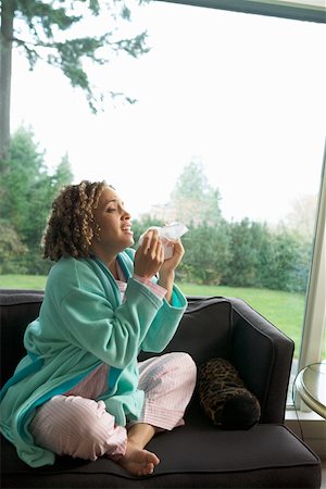 someone about to sneeze - Sneezing woman on couch in pajamas Stock Photo - Premium Royalty-Free, Code: 673-02140362