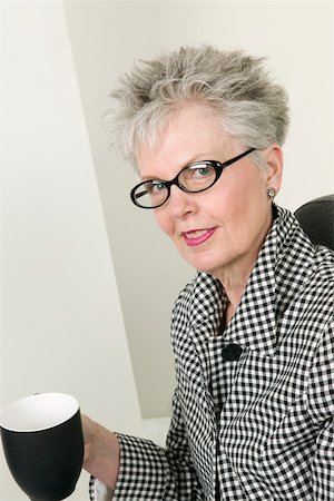 pretty gray hair smiling - Middle aged businesswoman with coffee cup Stock Photo - Premium Royalty-Free, Code: 673-02140467